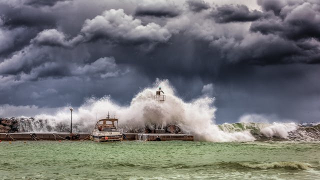 waves crashing on a boat shore