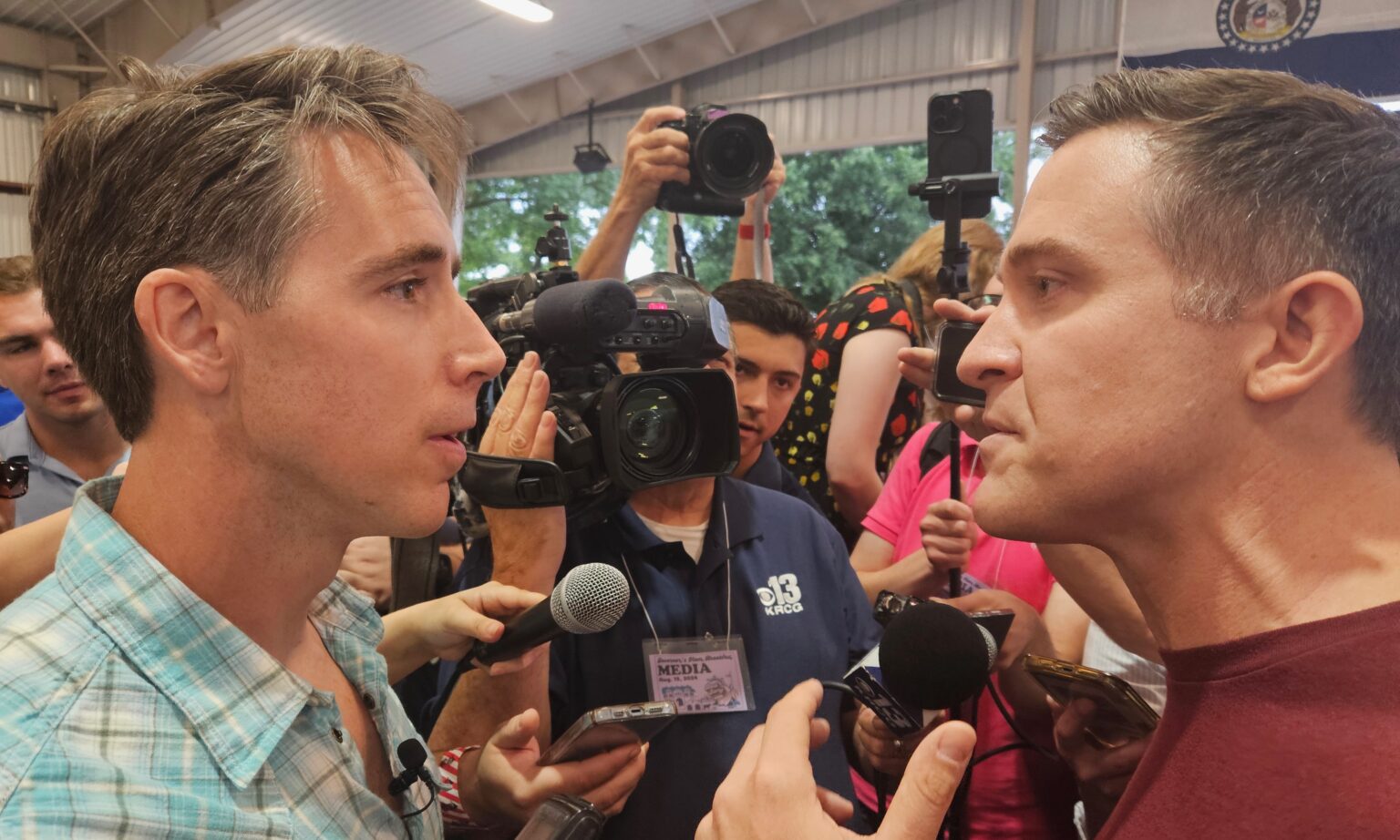 josh hawley and lucas kunce staring at each other